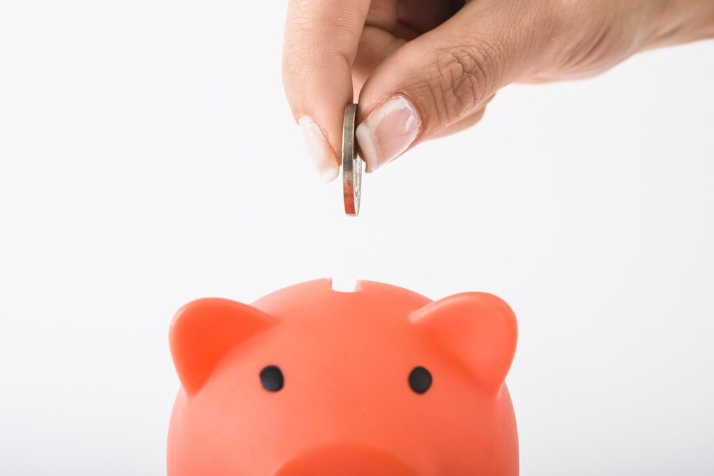 Emergency fund savings jar with cash and coins